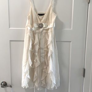 BCBG Ivory Dress! Feminine details including sparkle broach & vertical ruffles